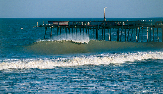 Surf fishing from the Hatteras pier on North Carolina Outer Banks